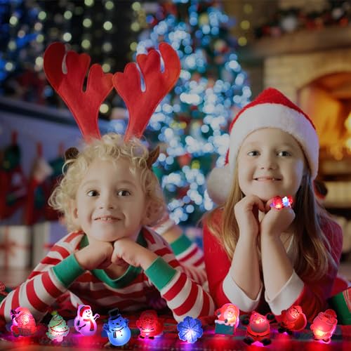 VEYLIN Juguetes de anillo con luz de Navidad, 24 piezas de anillos brillantes de Papá Noel para niños, juguetes de fiesta de Navidad